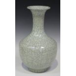 A Chinese Guan-type crackle glazed porcelain bottle vase, the stout shouldered body and flared