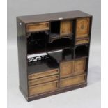 A Japanese hardwood display shelf, Meiji period, the rectangular top above an arrangement of