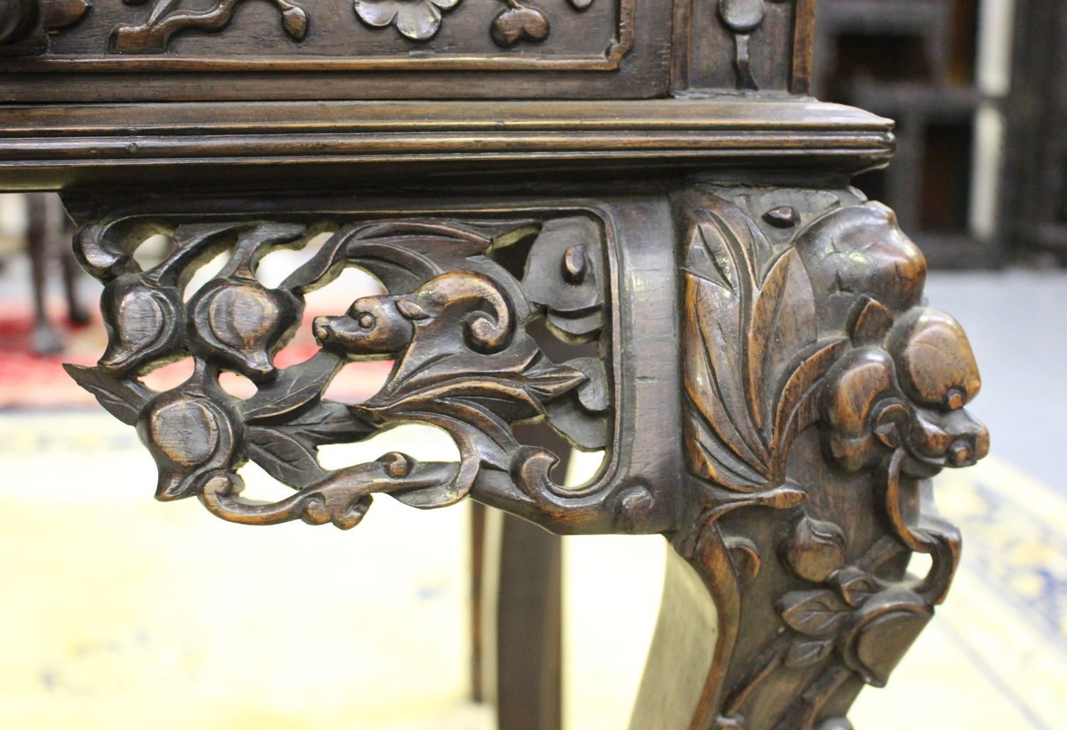 A Chinese hardwood writing desk with carved blossoming prunus decoration, late 19th century, the - Image 9 of 14