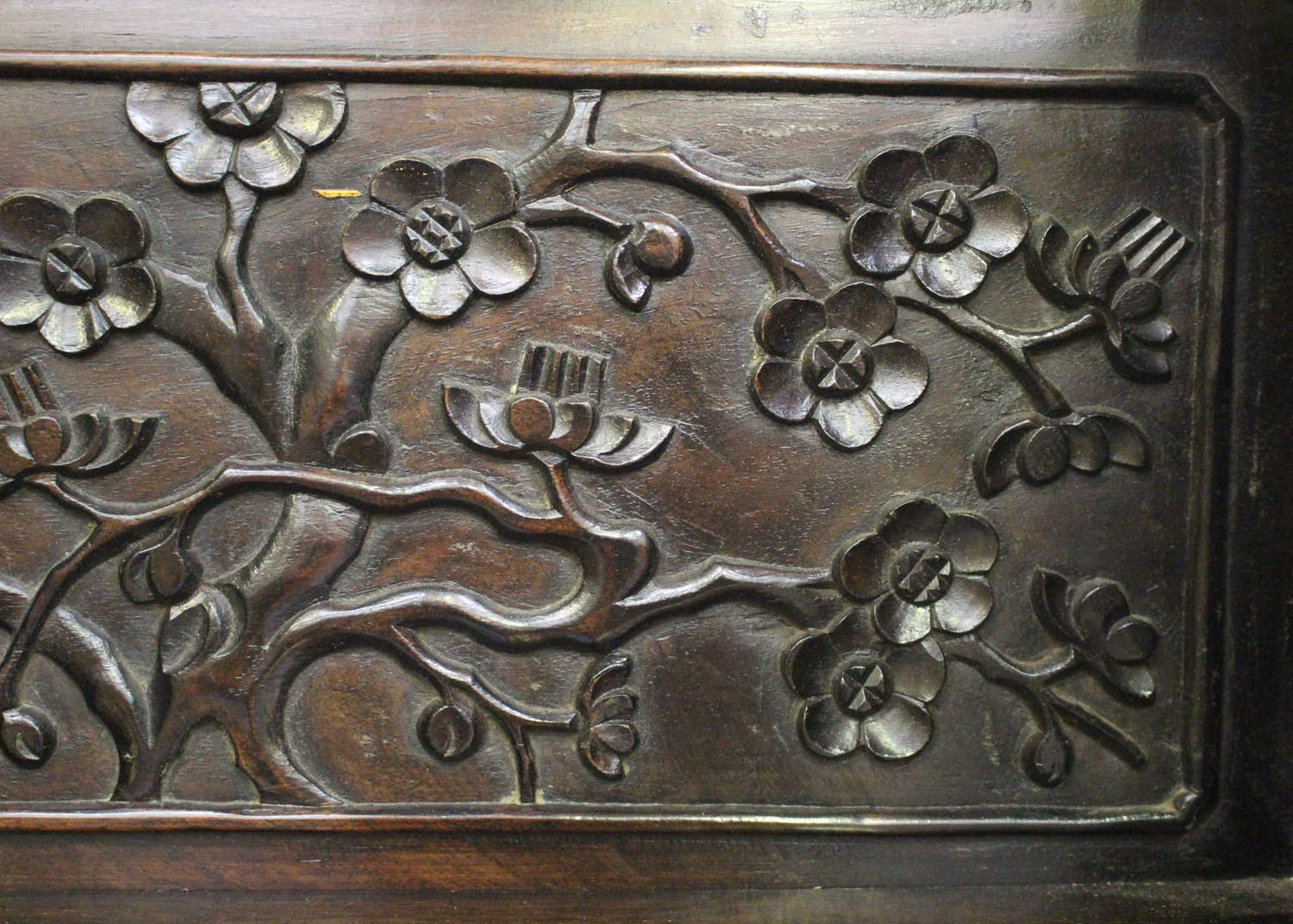 A Chinese hardwood writing desk with carved blossoming prunus decoration, late 19th century, the - Image 2 of 14