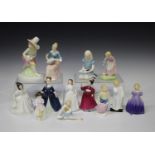 Thirteen Royal Doulton porcelain figures, comprising 'Daddy's Girl', HN3435, 'Alice', HN2158, '