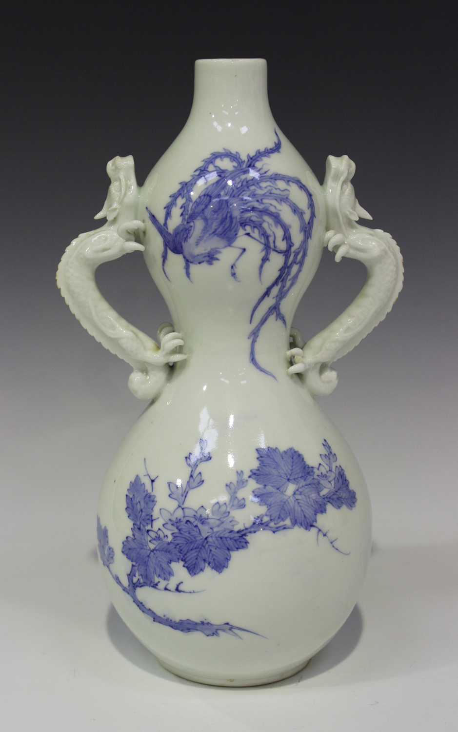 A Japanese Hirado blue and white porcelain vase, Meiji period, the double-gourd shaped body