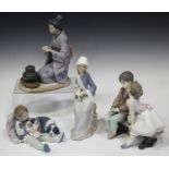 Four Lladro porcelain figures, comprising Ten and Growing, model No. 7635, Sweet Dreams, model No.