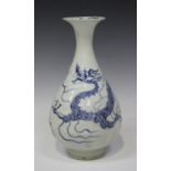A Chinese blue and white porcelain vase, the pear form body painted with a dragon beneath a flared