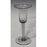 A double series opaque twist stem wine glass, circa 1770, the bell bowl raised on a plain stem