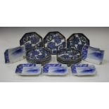 A set of eleven Japanese Arita Imari porcelain octagonal dishes, Meiji period, each painted with
