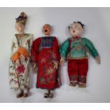 Three Chinese opera dolls, early 20th century, each wearing original silk embroidered costume,