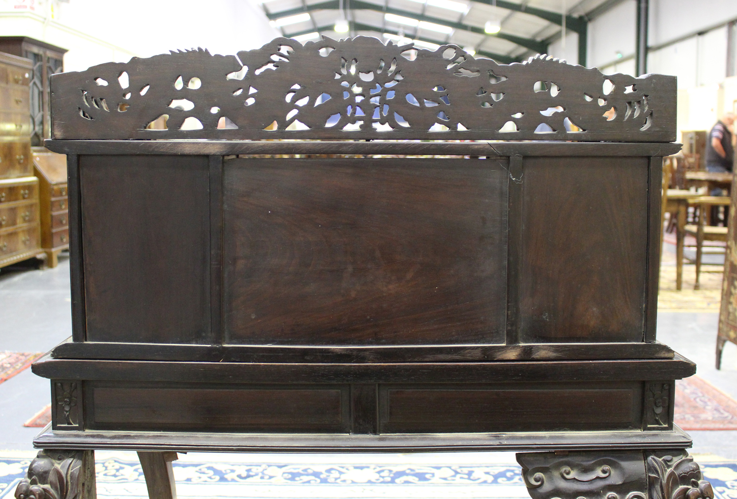 A Chinese hardwood writing desk with carved blossoming prunus decoration, late 19th century, the - Image 5 of 14