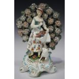 An English porcelain Chelsea Derby style bocage figure, 19th century, modelled as a maiden
