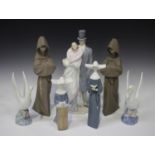 Two Lladro Gres stoneware figures of monks, model No. 2060, together with two Lladro nuns,