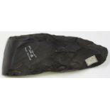 A New Guinea part-polished black stone axe, inscribed 'New Guinea Area Part Polished' with F.