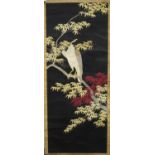 A Japanese silk embroidered scroll hanging, Meiji period, worked in coloured threads with an eagle