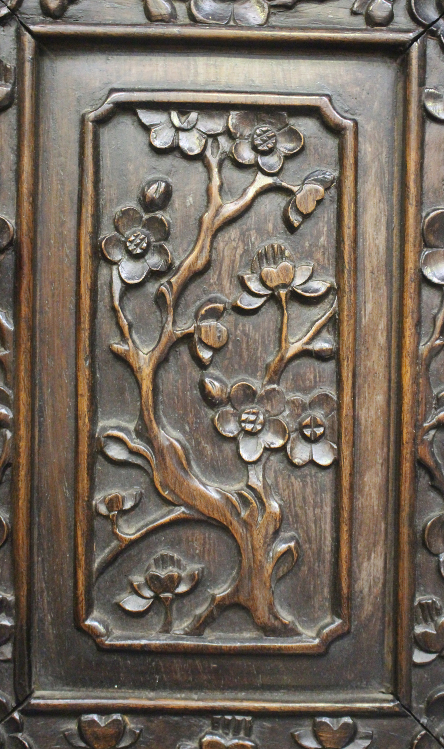 A Chinese hardwood writing desk with carved blossoming prunus decoration, late 19th century, the - Image 10 of 14