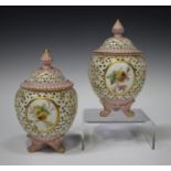 A pair of Grainger & Co Worcester Royal China Works pierced potpourri vases and domed covers, late