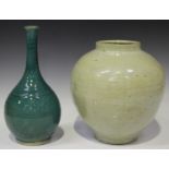 A Southern Chinese green glazed pottery bottle vase, late Qing dynasty, the ovoid body with flared