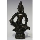 A Chinese brown patinated bronze figure of Buddha, late Qing dynasty, modelled seated on a lotus