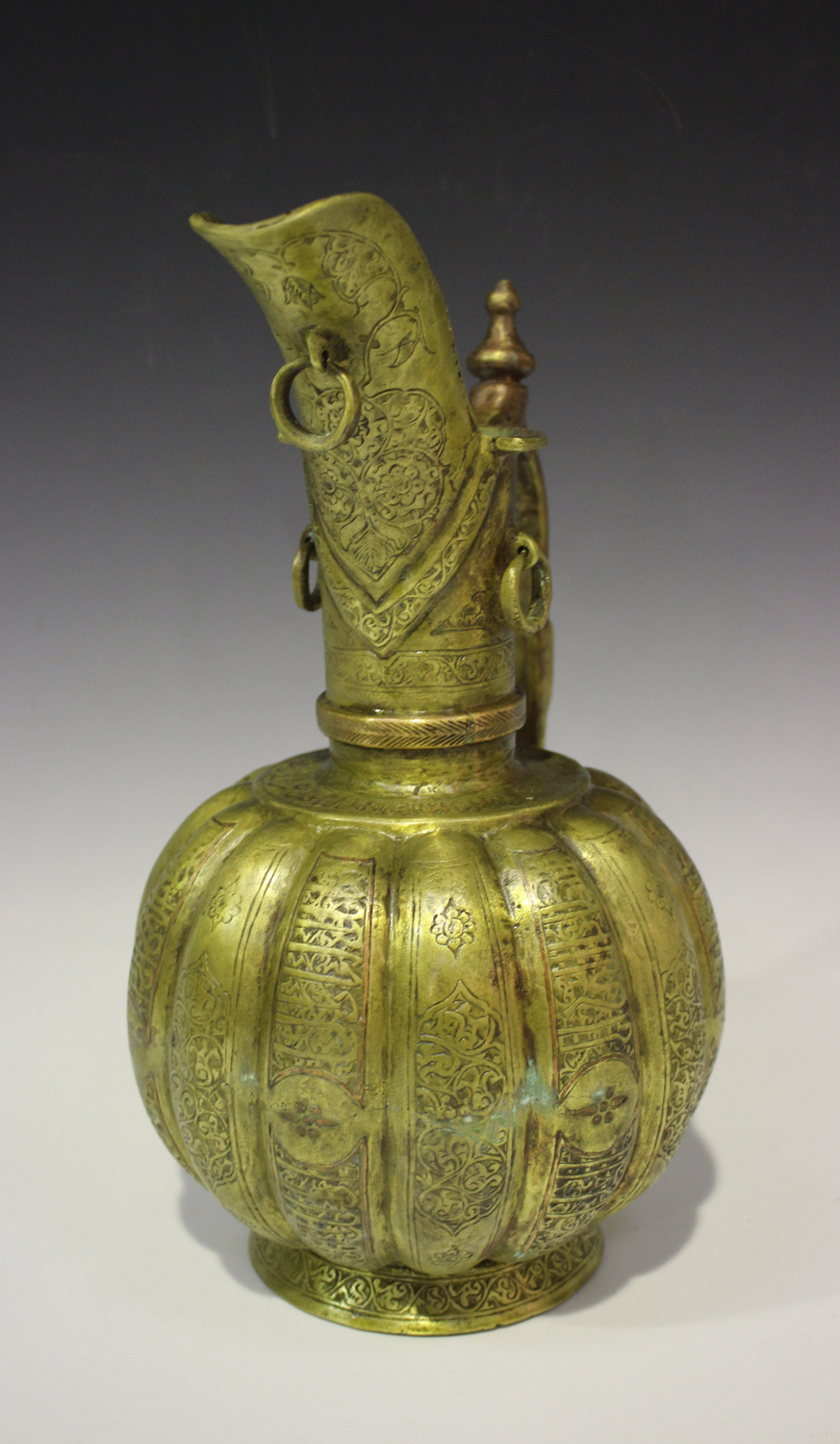 A Khorasan brass ewer, the lobed body and flared neck engraved with foliate and script panels within - Image 2 of 2