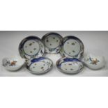A set of five Japanese Kakiemon porcelain circular dishes, 19th century, each painted in