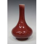 A Chinese sang-de-boeuf glazed bottle vase, probably 20th century, the low-bellied body and narrow