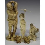 A group of three Japanese okimono carvings, Meiji period, comprising two gentlemen and a bijin