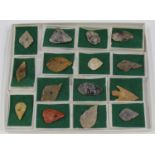 A collection of fifteen British Neolithic flint arrowheads, one barbed and tanged, some detailed