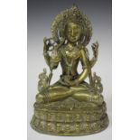 A Sino-Tibetan bronze figure of a bodhisattva, early 20th century, the four-armed deity modelled