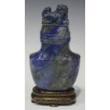 A Chinese lapis lazuli vase and cover, 20th century, of compressed spade form, the cover with carved