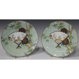A pair of Mintons Aesthetic porcelain plates, circa 1876, decorated in Japonisme style with a
