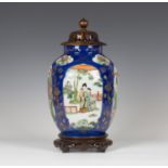 A Chinese famille verte powder blue ground porcelain jar, Kangxi style but late Qing dynasty, of