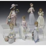 Six Lladro porcelain figures, comprising Innocence In Bloom, model No. 7644, School Days, model