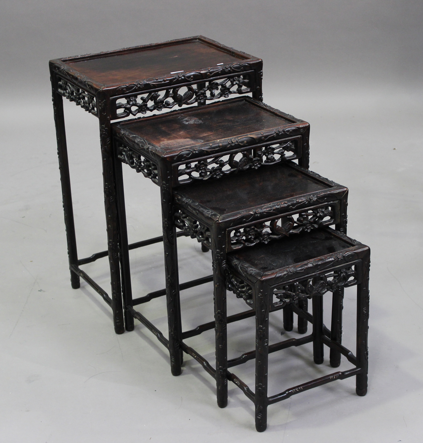 A Chinese carved hardwood quartetto nest of occasional tables, early 20th century, each