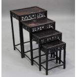 A Chinese carved hardwood quartetto nest of occasional tables, early 20th century, each