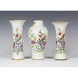A Chinese famille rose export porcelain garniture of three vases, Qianlong period, comprising a pair