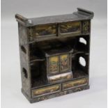 A Japanese lacquer table-top cabinet, Meiji period, fitted with a symmetrical arrangement of