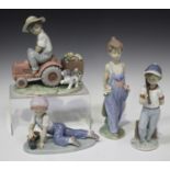 Four Lladro porcelain figures, comprising Pocket Full of Wishes, model No. 7650, A Day's Work, model
