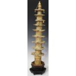 A Chinese carved and stained ivory model of a nine-storey pagoda, late Qing dynasty, each level