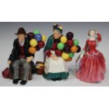 Three Royal Doulton figures, comprising 'The Old Balloon Seller', HN1315, 'The Balloon Man', HN1954,