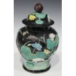 A Chinese famille noire enamelled biscuit porcelain jar and cover, late Qing dynasty, the baluster