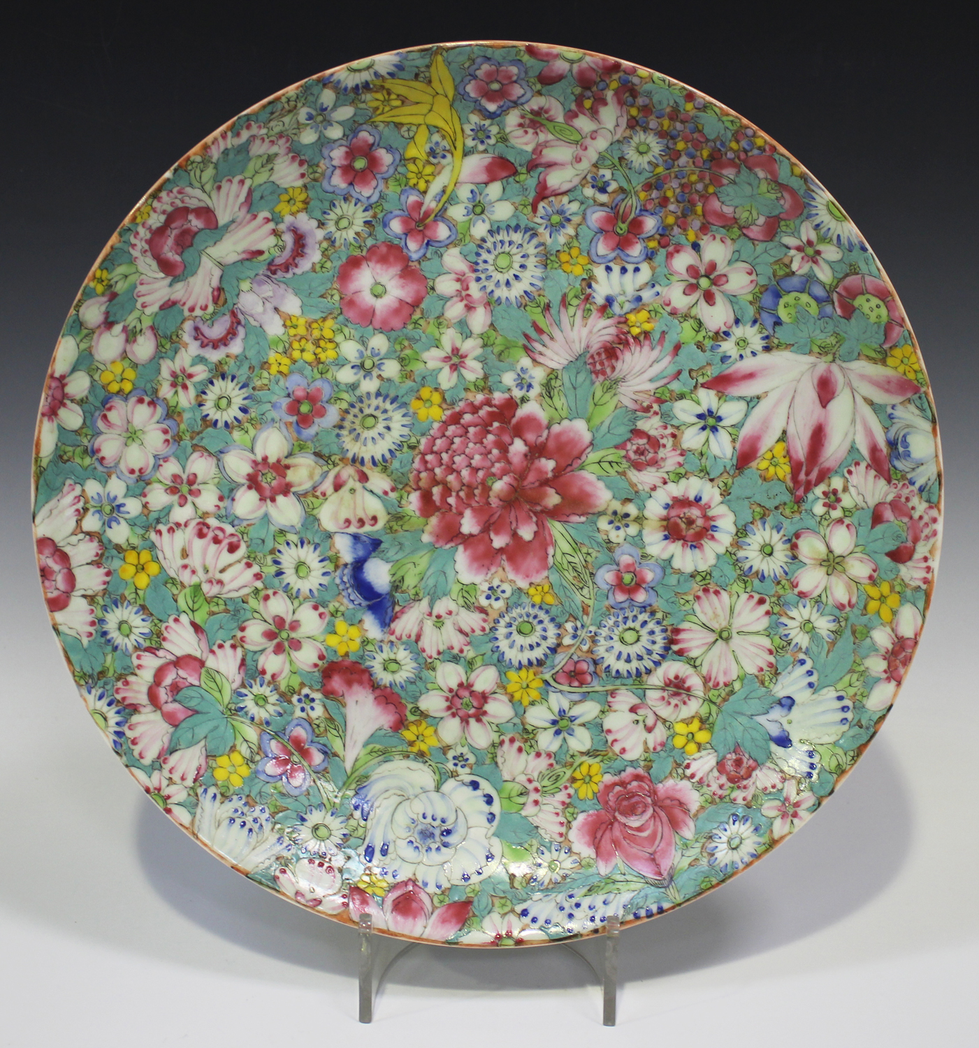 A Chinese famille rose millefleurs porcelain circular dish, mark of Qianlong but Republic period,