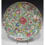 A Chinese famille rose millefleurs porcelain circular dish, mark of Qianlong but Republic period,