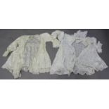 A late Victorian silk and lacework lady's dress, another similar dress and two blouses.Buyer’s