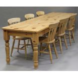 A modern pine kitchen table, height 75cm, length 274cm, depth 77cm, together with six bar back