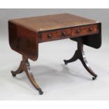 A George IV mahogany sofa table with ebony stringing, fitted with two frieze drawers and opposing