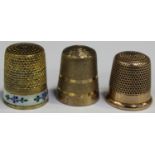A 9ct gold thimble with a textured finish, Birmingham probably 1967, another gold thimble,