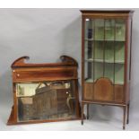 An Edwardian mahogany display cabinet, fitted with a single glazed door, on square tapering legs,