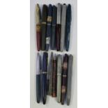 A group of fountain pens, including an Esterbrook grey cased pen, a Parker Duofold and other