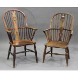 A 19th century yew, ash and elm pierced splat back Windsor armchair, the solid seat raised on turned