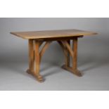 An early 20th century Arts and Crafts oak centre table, in the manner of Heals, the rectangular
