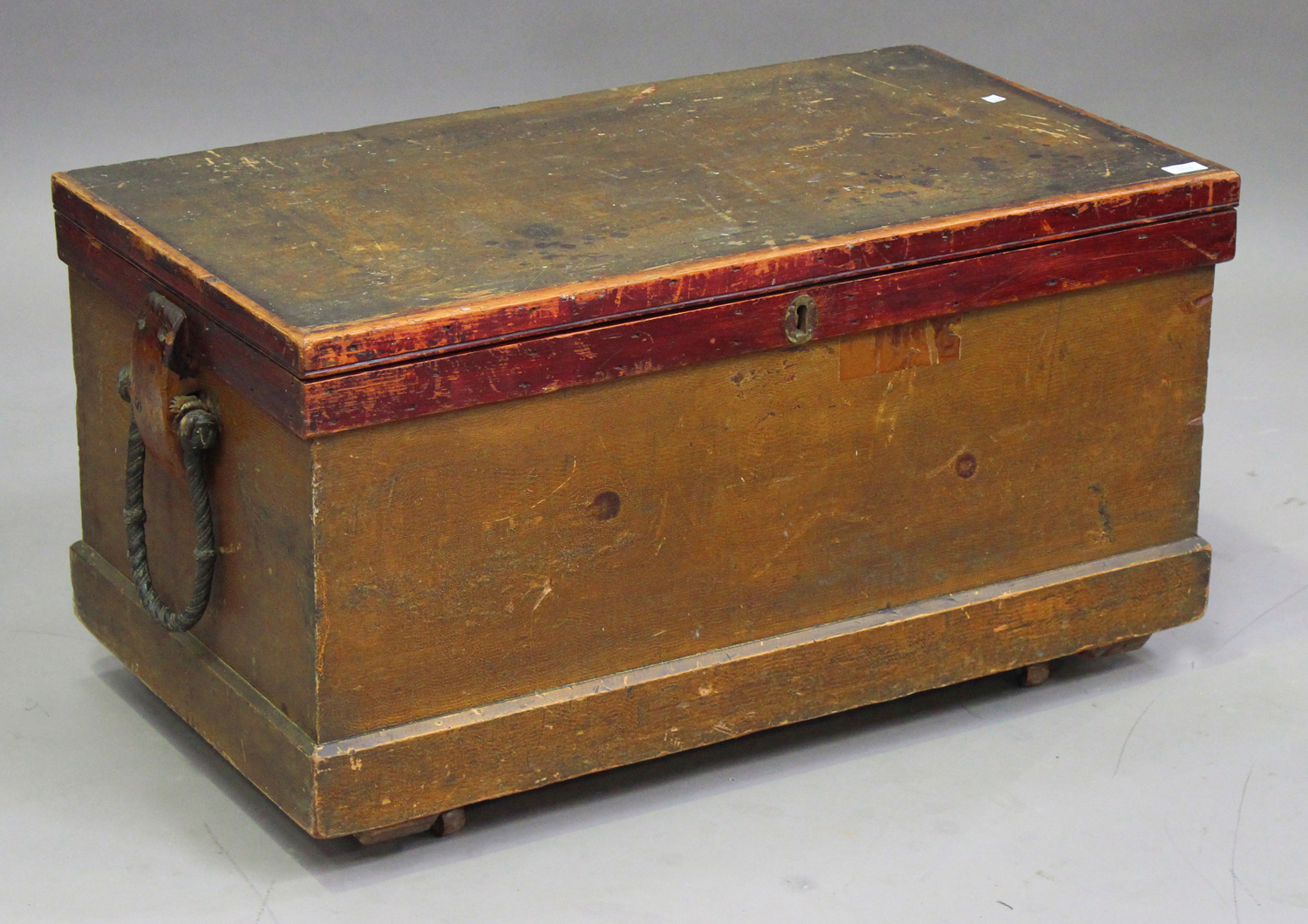 A 19th century stained pine seaman's chest, the sides fitted with rope carrying handles, height