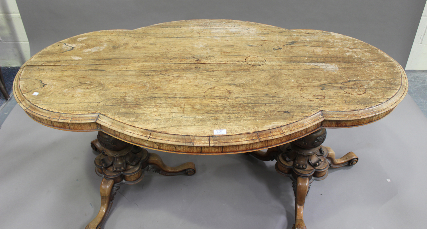 An early Victorian rosewood centre table, the shaped top raised on two turned and carved baluster - Image 2 of 3